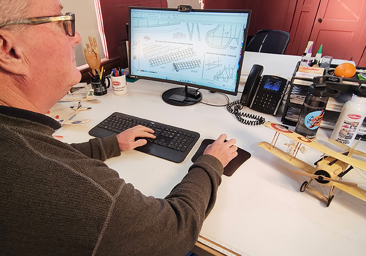 Mark Tennant at computer Mark Tennant at computer